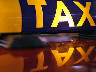 Two men on the run after taxi...